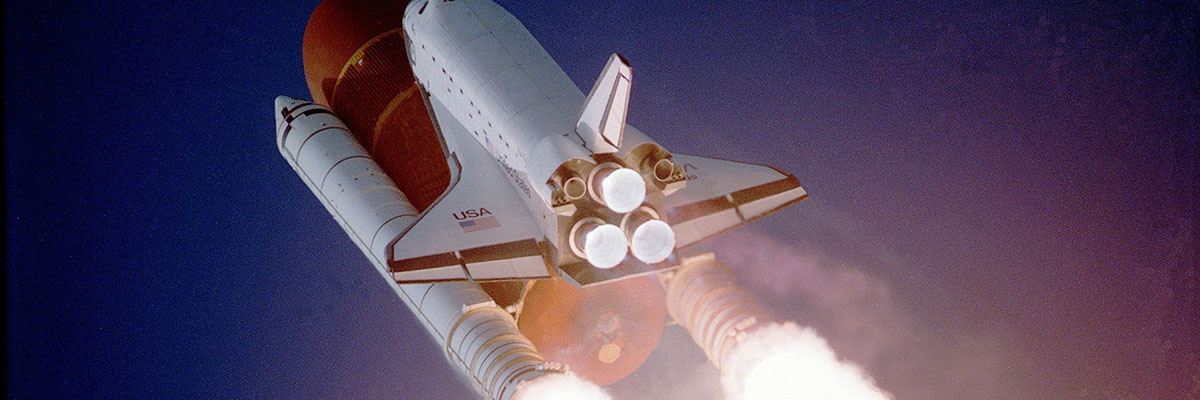 Space shuttle flying into space.