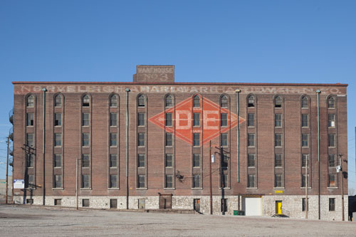 Old warehouse with a DE logo on it.